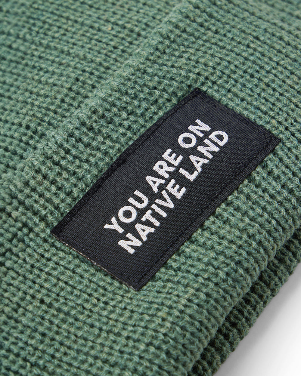 'YOU ARE ON NATIVE LAND' RIBBED BEANIE - JADE