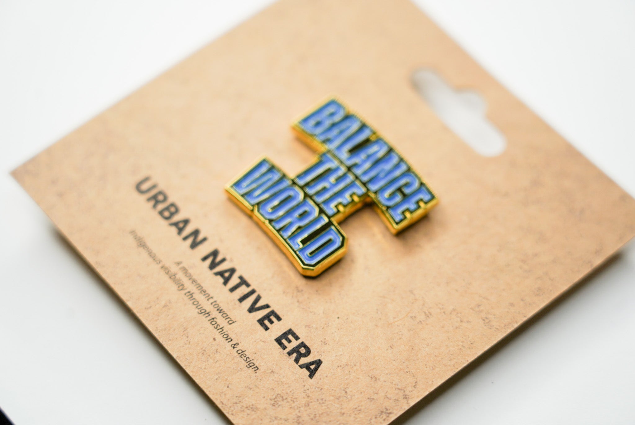 BALANCE THE WORLD ENAMEL PIN - BLUE & GOLD