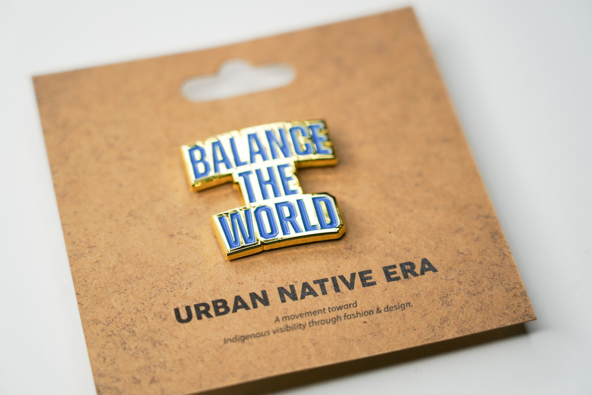 BALANCE THE WORLD ENAMEL PIN - BLUE & GOLD
