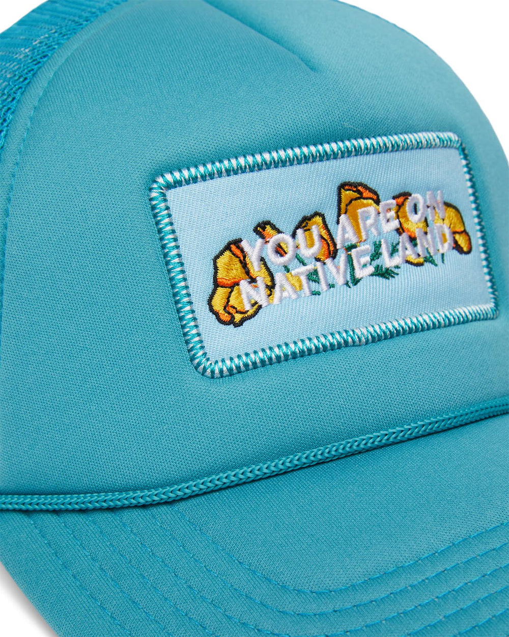 'YOU ARE ON NATIVE LAND' TRUCKER - TURQUOISE TONIC POPPY