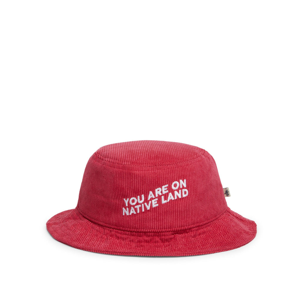 'YOU ARE ON NATIVE LAND' CORDUROY BUCKET HAT - RED