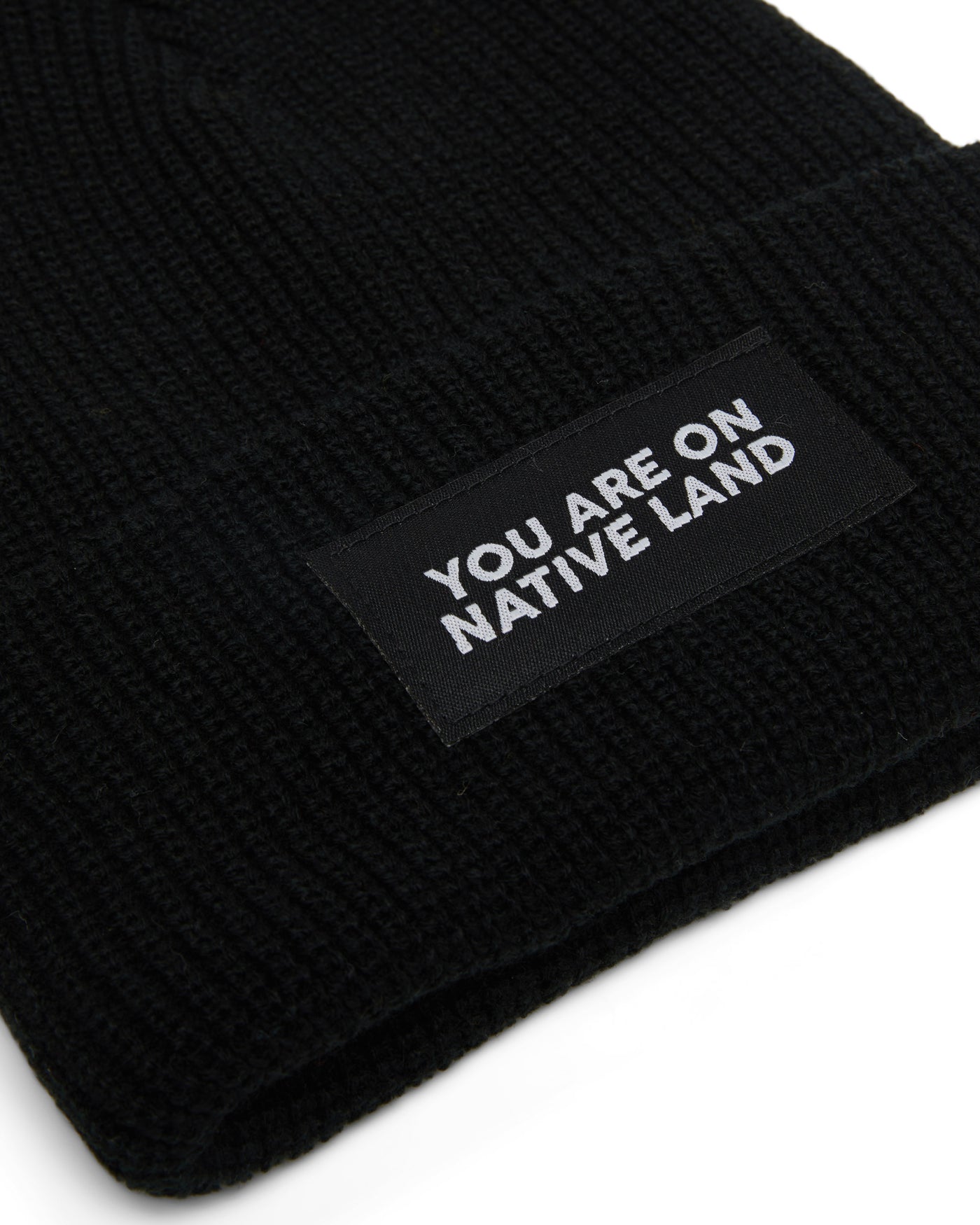 'YOU ARE ON NATIVE LAND' RIBBED BEANIE - BLACK