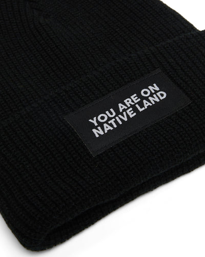 'YOU ARE ON NATIVE LAND' RIBBED BEANIE - BLACK