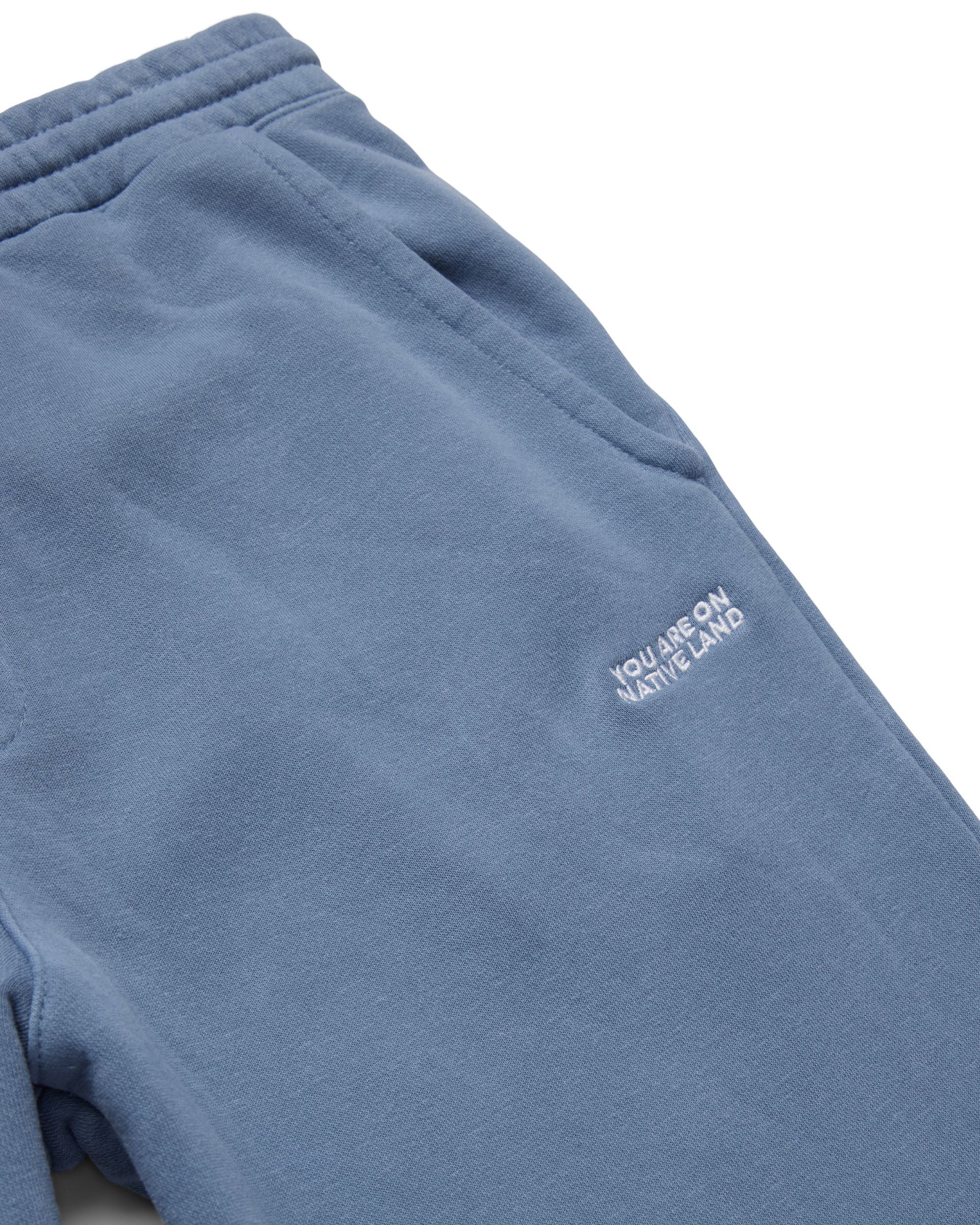 'YOU ARE ON NATIVE LAND' SWEATPANTS - SLATE BLUE